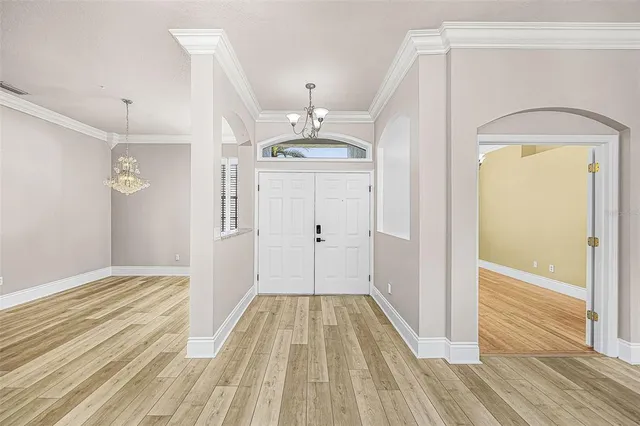 a view of a hallway view with wooden floor and staircase