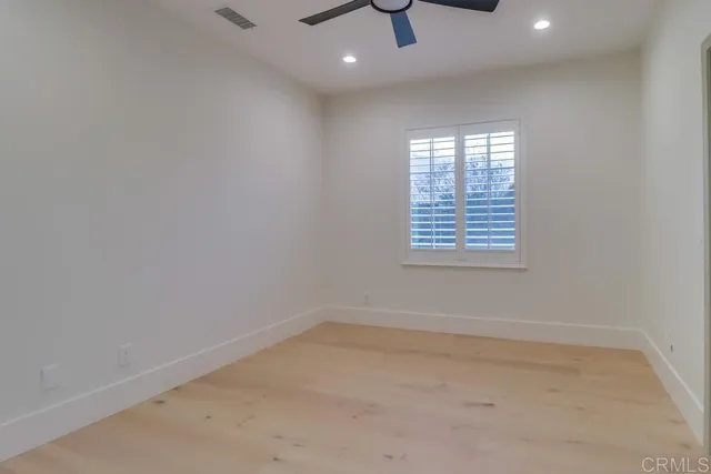 a bed room with a bed and a chandelier