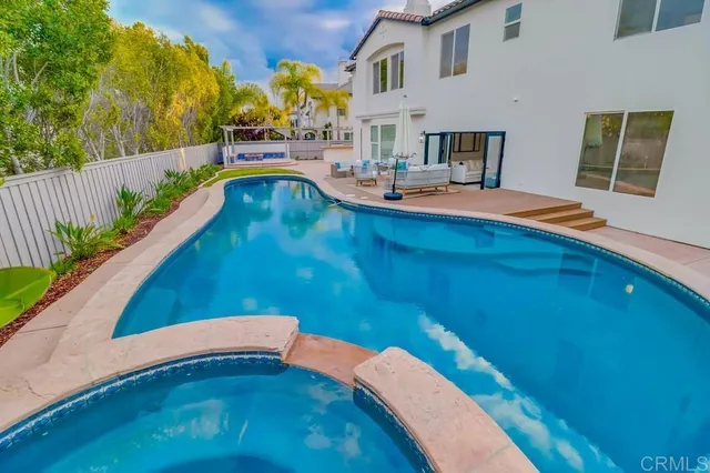 a view of a swimming pool with a patio