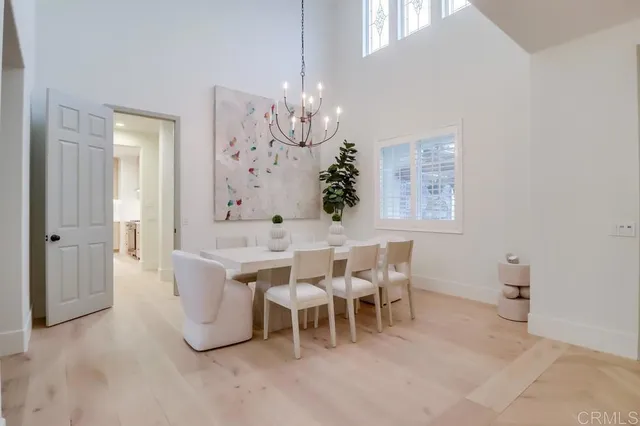 a living room with fireplace furniture and a large window