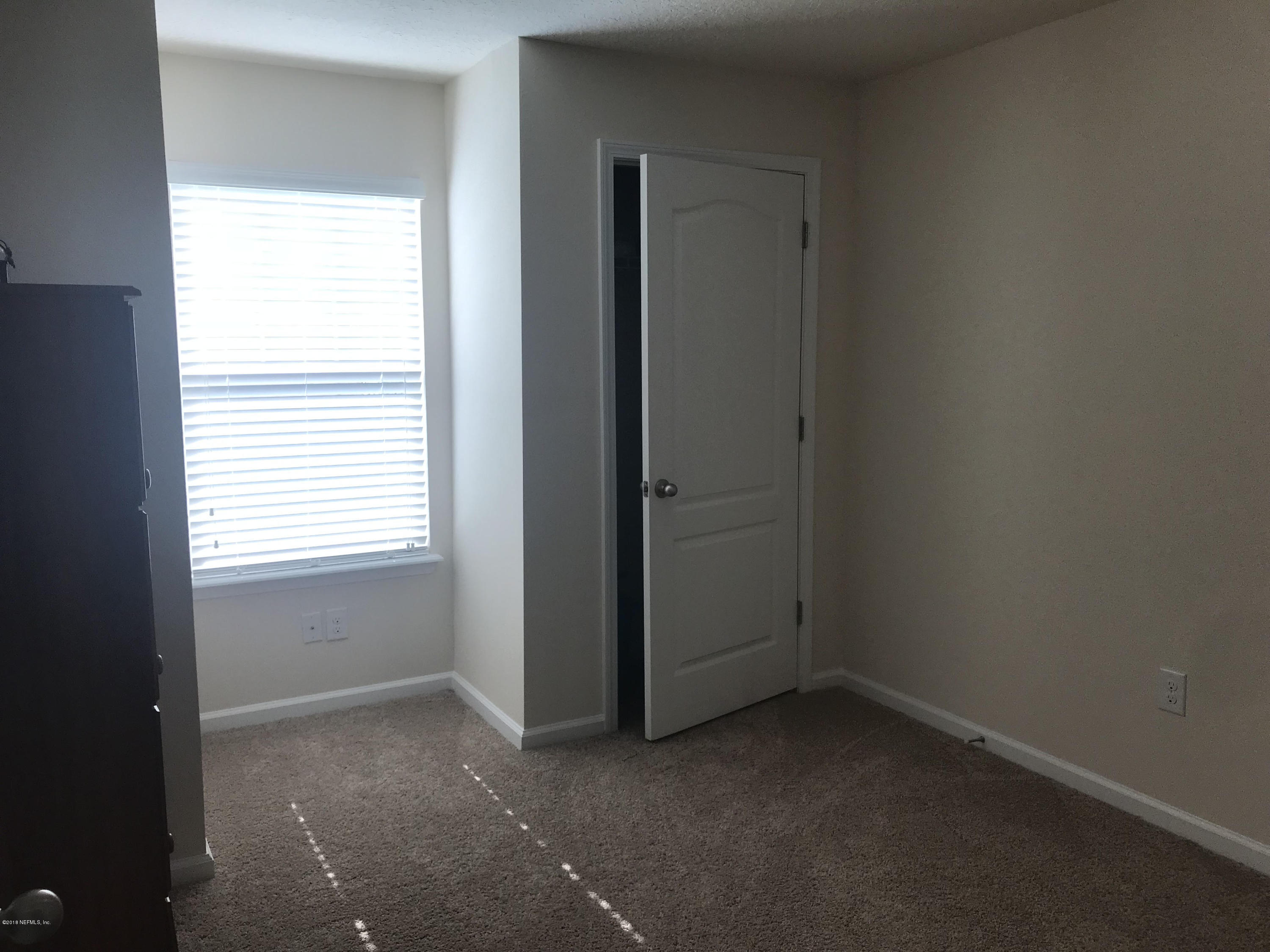 218 Larkin Place, Unit 111 St. Johns, FL 32259 - Photo 12 of 21 an empty room with windows