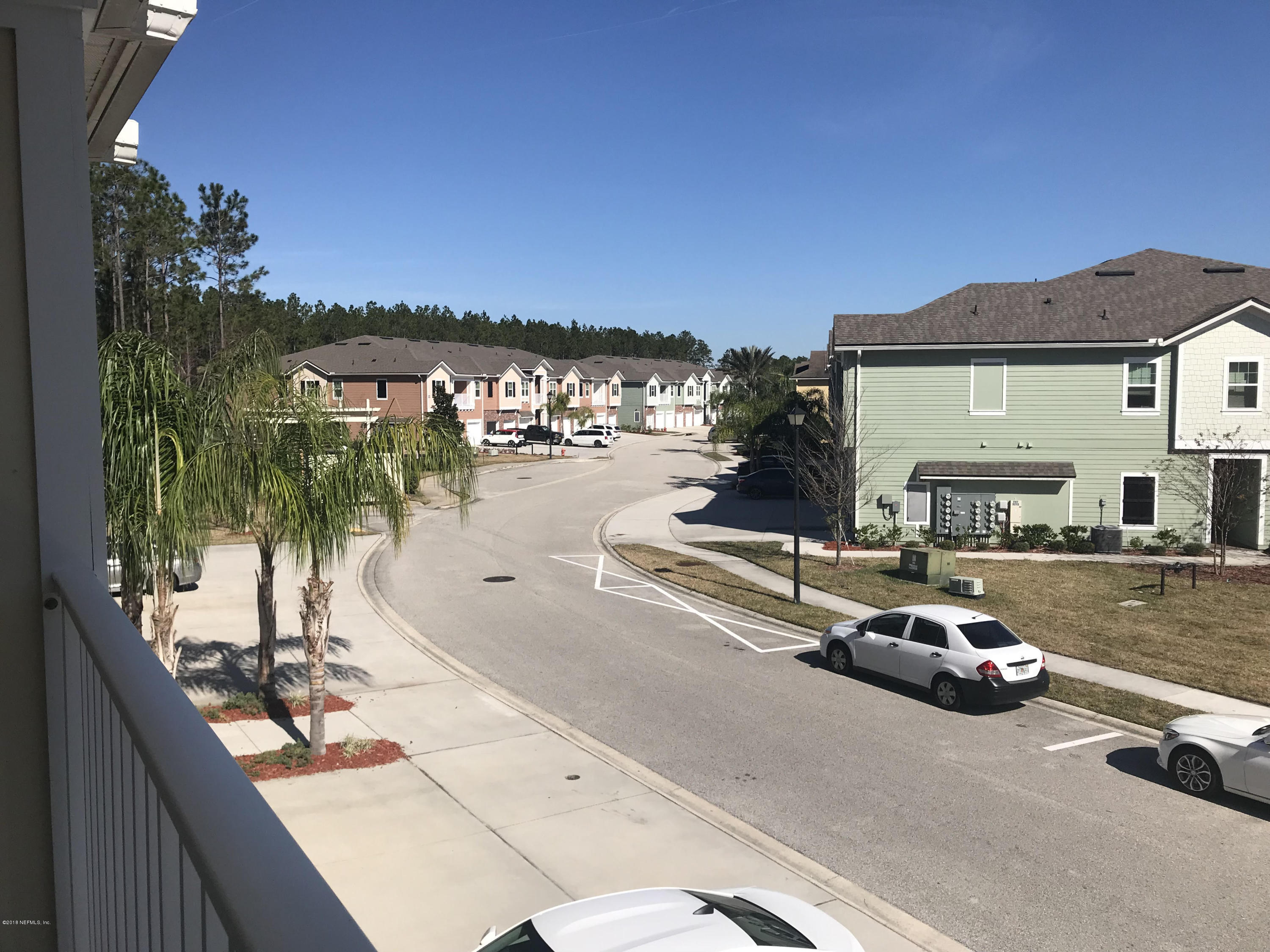 218 Larkin Place, Unit 111 St. Johns, FL 32259 - Photo 14 of 21 a view of a street with cars