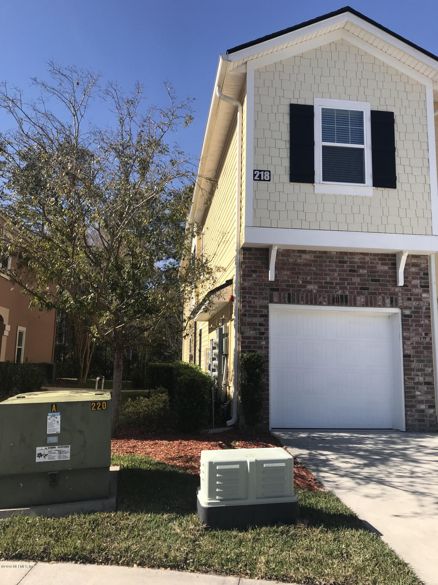 218 Larkin Place, Unit 111 St. Johns, FL 32259 - Photo 16 of 21 a view of a house with a yard