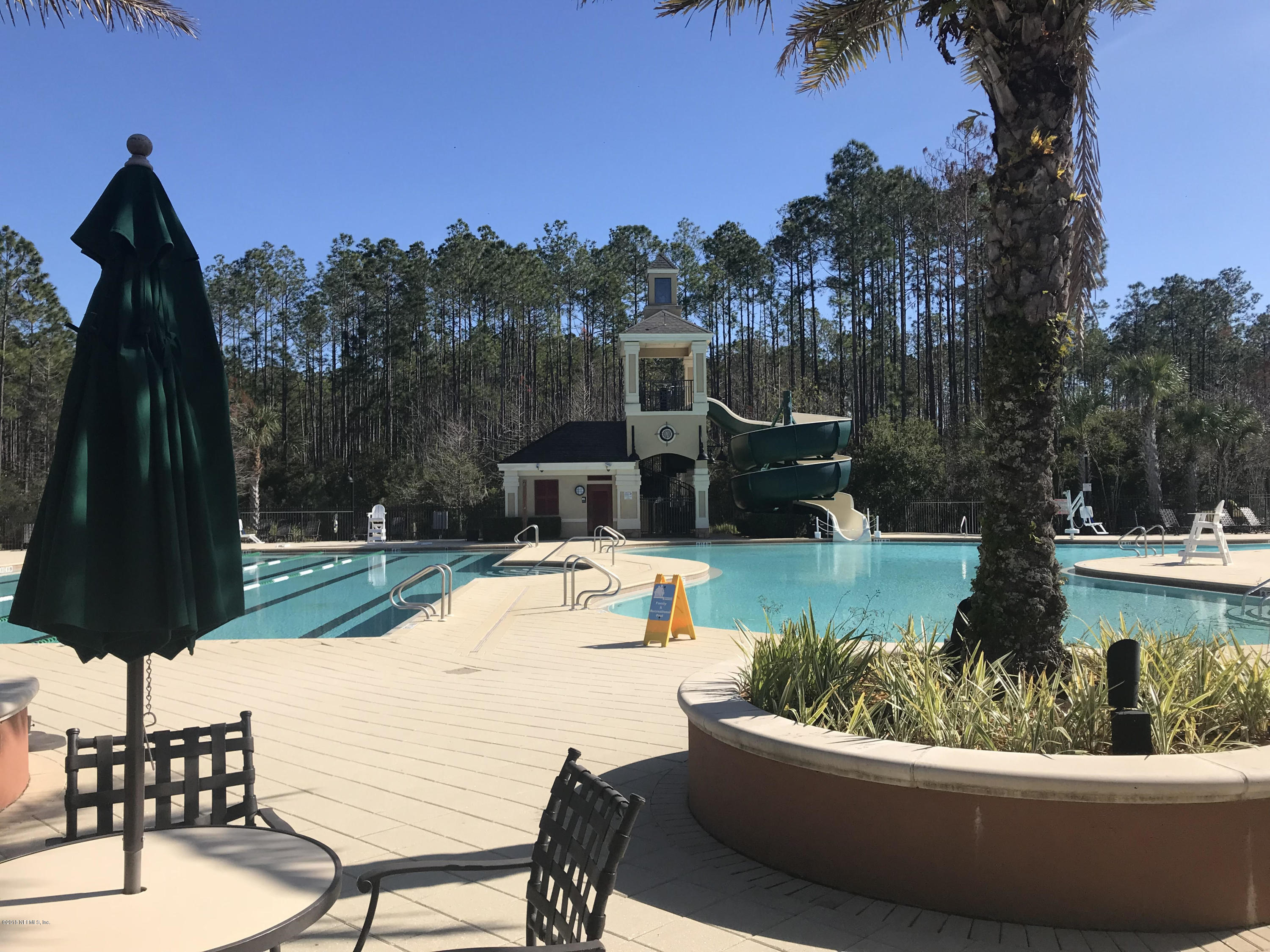218 Larkin Place, Unit 111 St. Johns, FL 32259 - Photo 17 of 21 a view of a swimming pool with a patio