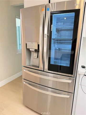 a kitchen with a sink a stove and a microwave