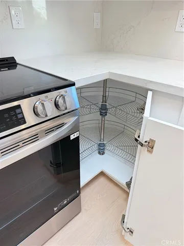 a kitchen with a sink a cabinets and window