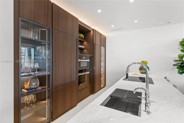 a spacious bedroom with a bed and a large window