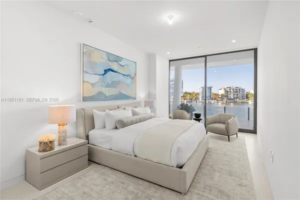 a bathroom with a double vanity sink mirror and bathtub