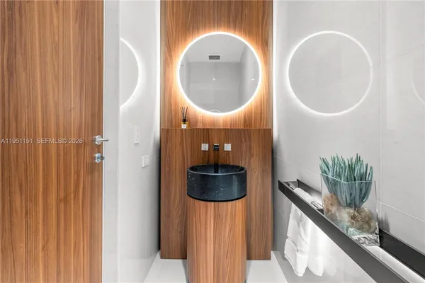a bathroom with a bathtub and a sink