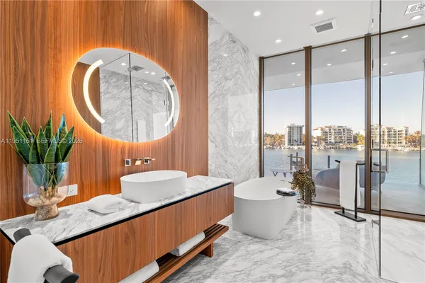 a view of an empty room with glass door