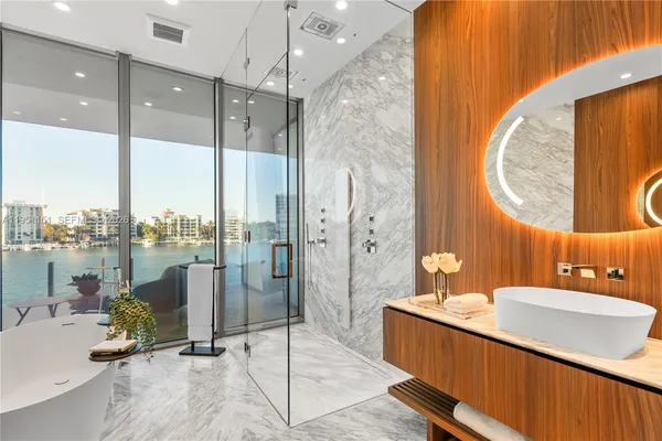 a kitchen with a sink and stainless steel appliances