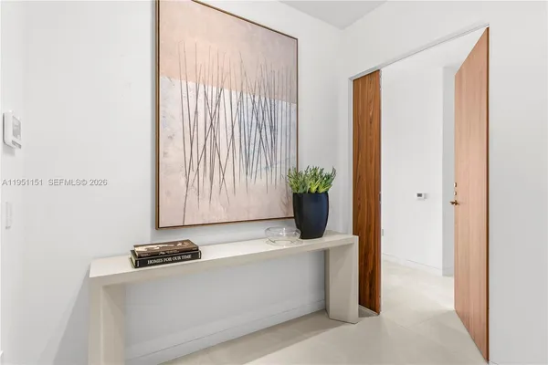 a bathroom with a sink mirror toilet and bathtub