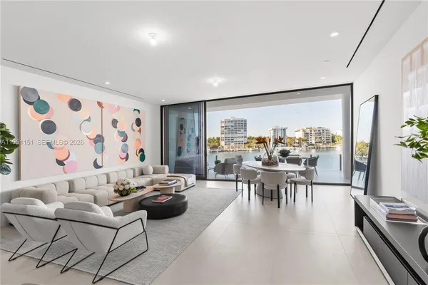 a bathroom with a granite countertop sink a mirror and a shower