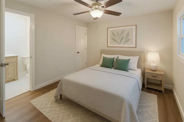 a bedroom with a bed and window