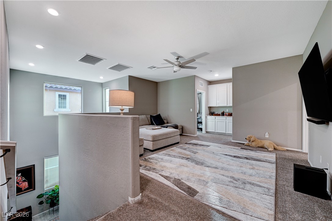 3826 Asia Road North Las Vegas, NV 89032 - Photo 17 of 30 Upstairs loft featuring light colored carpet, recessed lighting, and a ceiling fan
