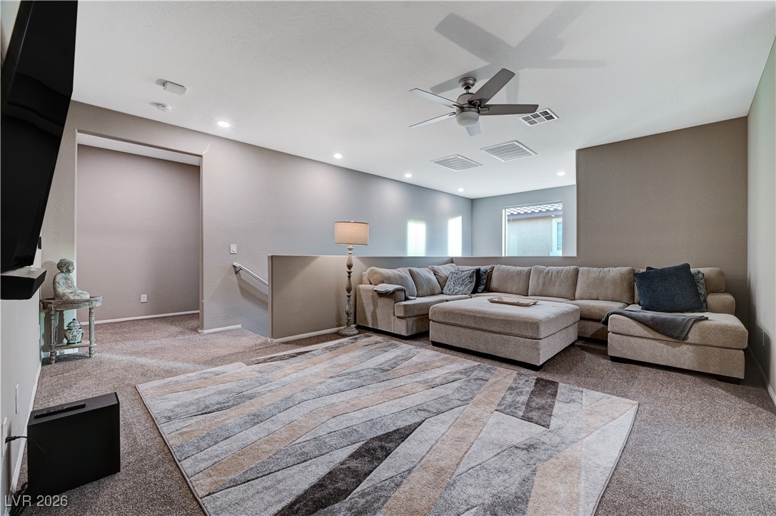 3826 Asia Road North Las Vegas, NV 89032 - Photo 18 of 30 Upstairs loft with light carpet, recessed lighting, and a ceiling fan