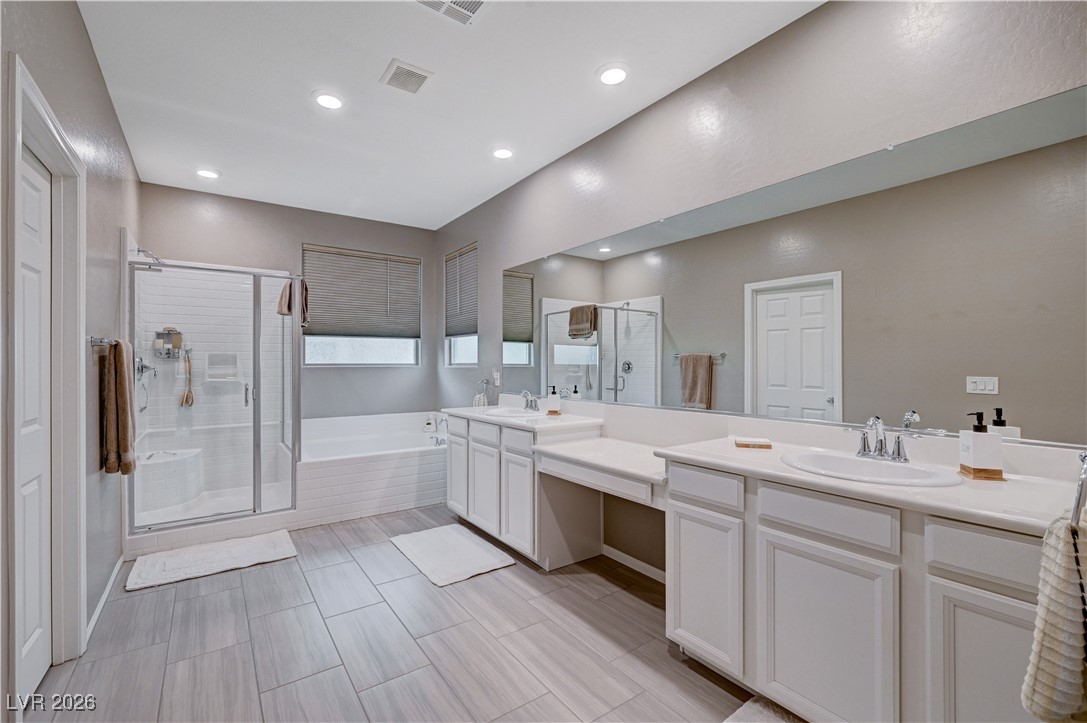 3826 Asia Road North Las Vegas, NV 89032 - Photo 21 of 30 Primary bathroom featuring a stall shower, a garden tub, double vanity, walk-in closet and recessed lighting
