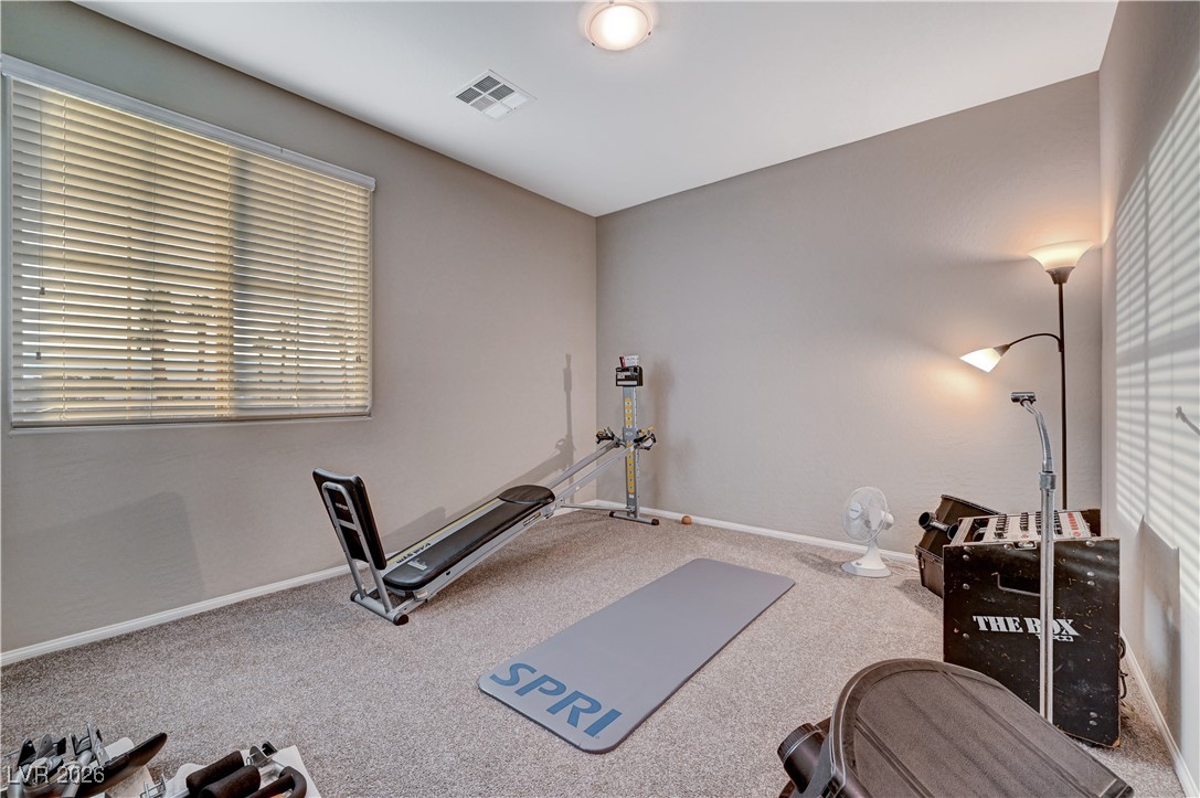 3826 Asia Road North Las Vegas, NV 89032 - Photo 24 of 30 3rd carpeted upstairs bedroom with walk-in closet and plenty of natural light