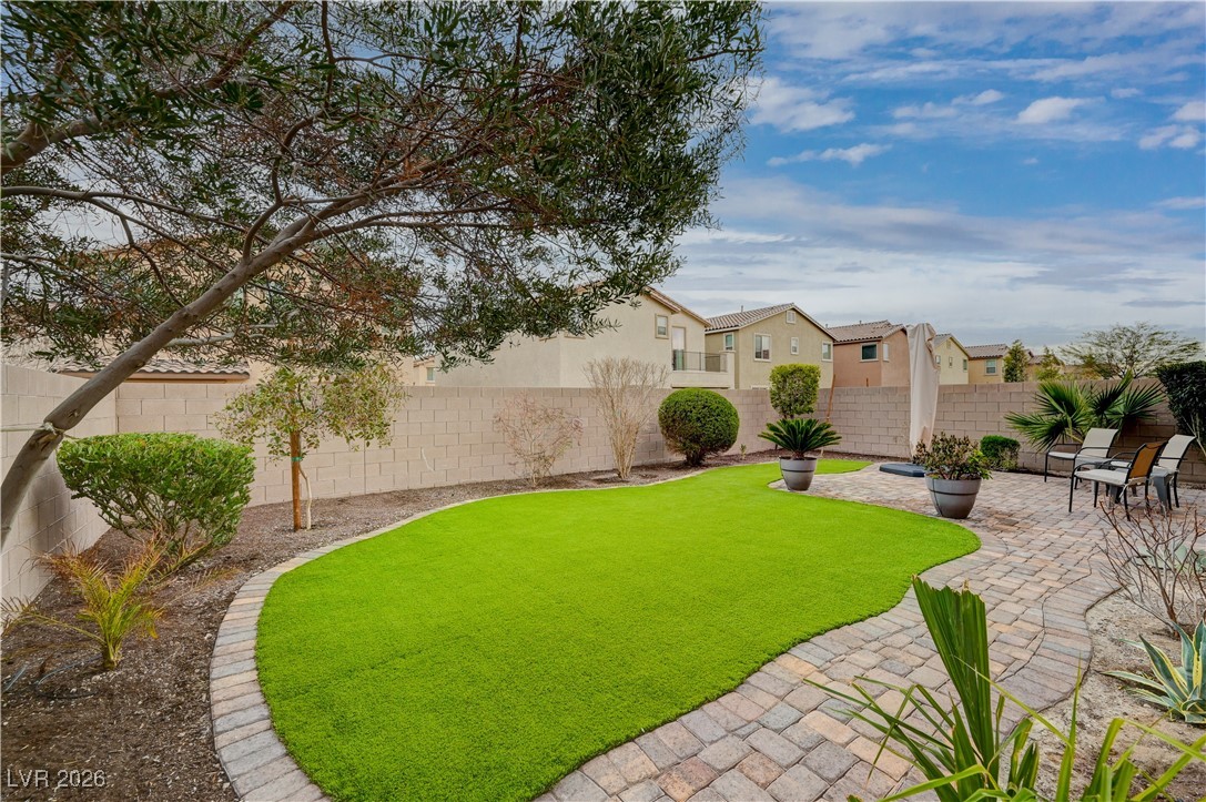 3826 Asia Road North Las Vegas, NV 89032 - Photo 27 of 30 Fenced backyard with a patio and a residential view