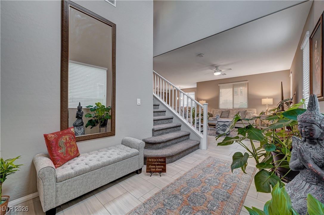 3826 Asia Road North Las Vegas, NV 89032 - Photo 4 of 30 Front entry with access to the upstairs and living room.