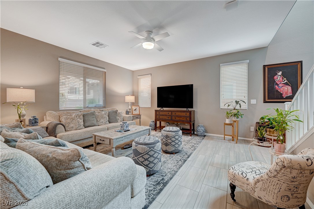 3826 Asia Road North Las Vegas, NV 89032 - Photo 5 of 30 Living area featuring ceiling fan and stairway