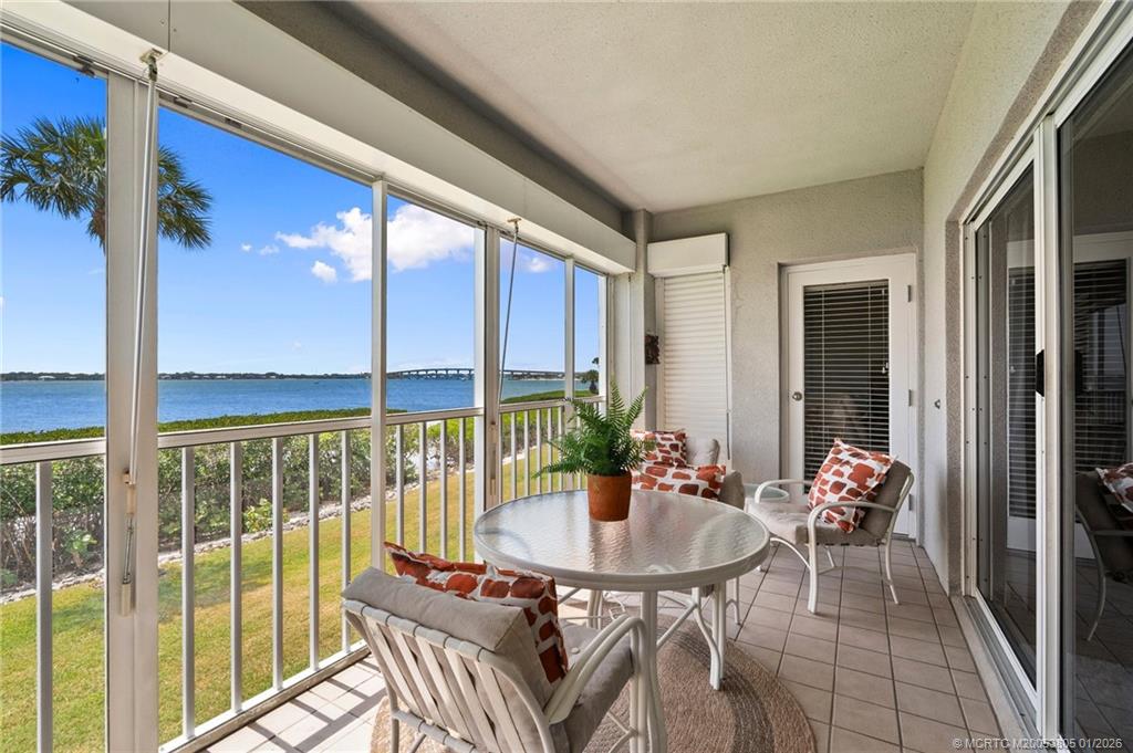 164 Northeast Edgewater Drive, Unit 2105 Jensen Beach, FL 34957 - Photo 22 of 35 a dining room with furniture and window