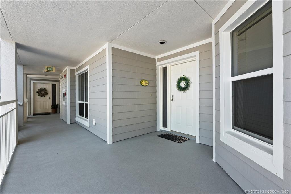 164 Northeast Edgewater Drive, Unit 2105 Jensen Beach, FL 34957 - Photo 24 of 35 a view of an empty room with closet and windows