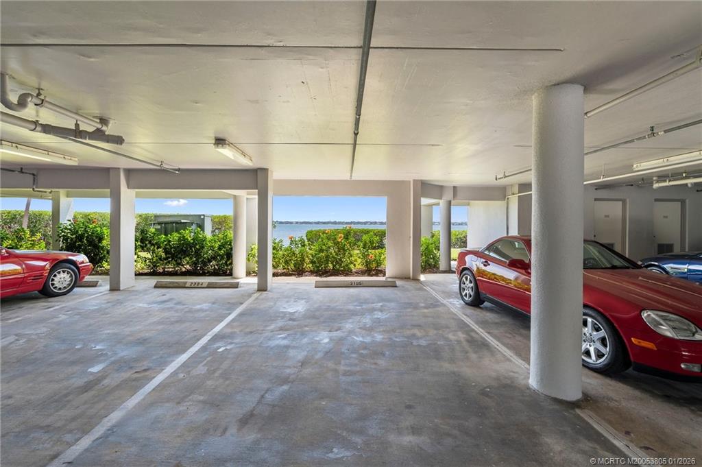 164 Northeast Edgewater Drive, Unit 2105 Jensen Beach, FL 34957 - Photo 25 of 35 a view of a car garage