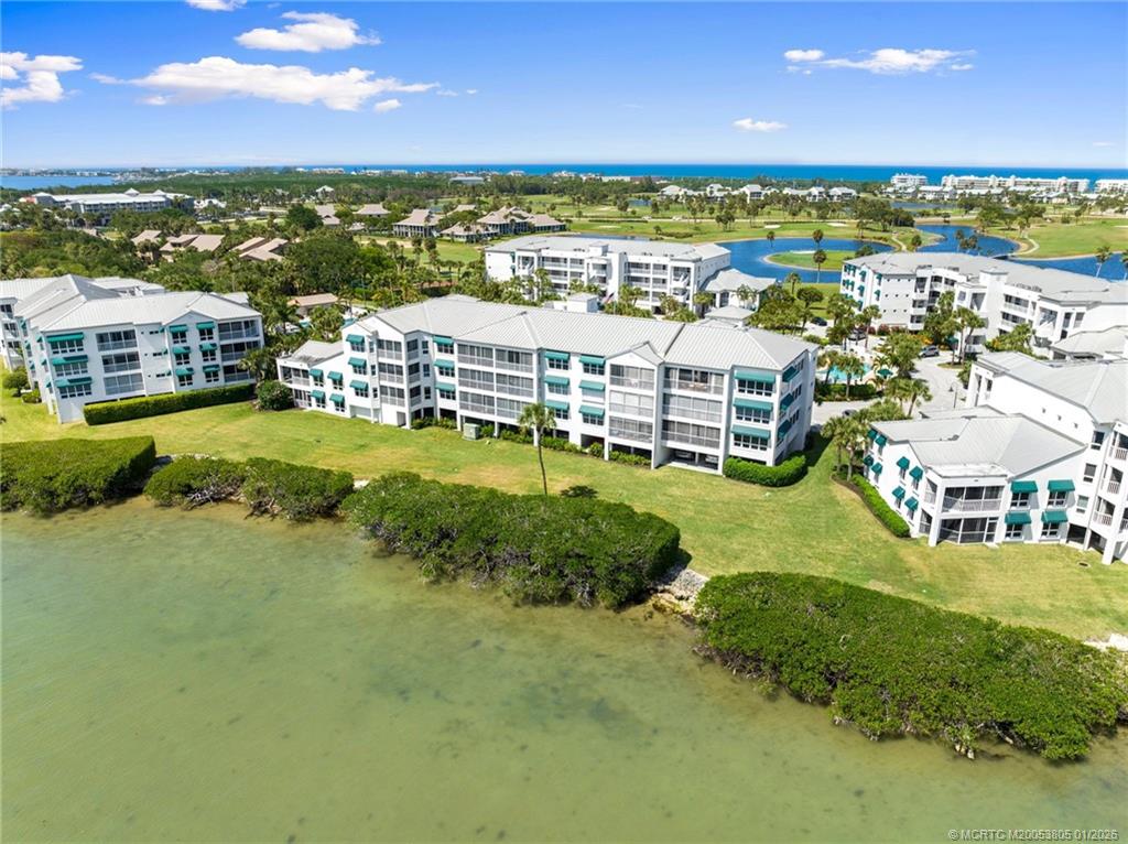 164 Northeast Edgewater Drive, Unit 2105 Jensen Beach, FL 34957 - Photo 30 of 35 a view of a city with tall buildings