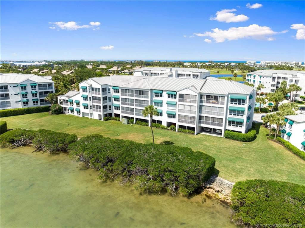 164 Northeast Edgewater Drive, Unit 2105 Jensen Beach, FL 34957 - Photo 31 of 35 a view of a city with tall buildings