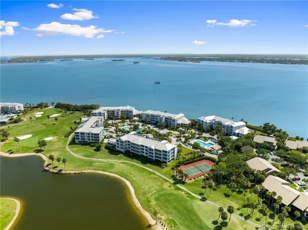 an aerial view of a house with a lake view