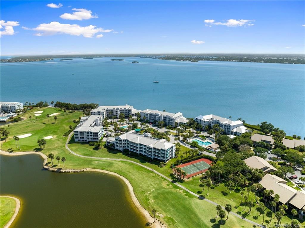 164 Northeast Edgewater Drive, Unit 2105 Jensen Beach, FL 34957 - Photo 32 of 35 an aerial view of a house with a lake view