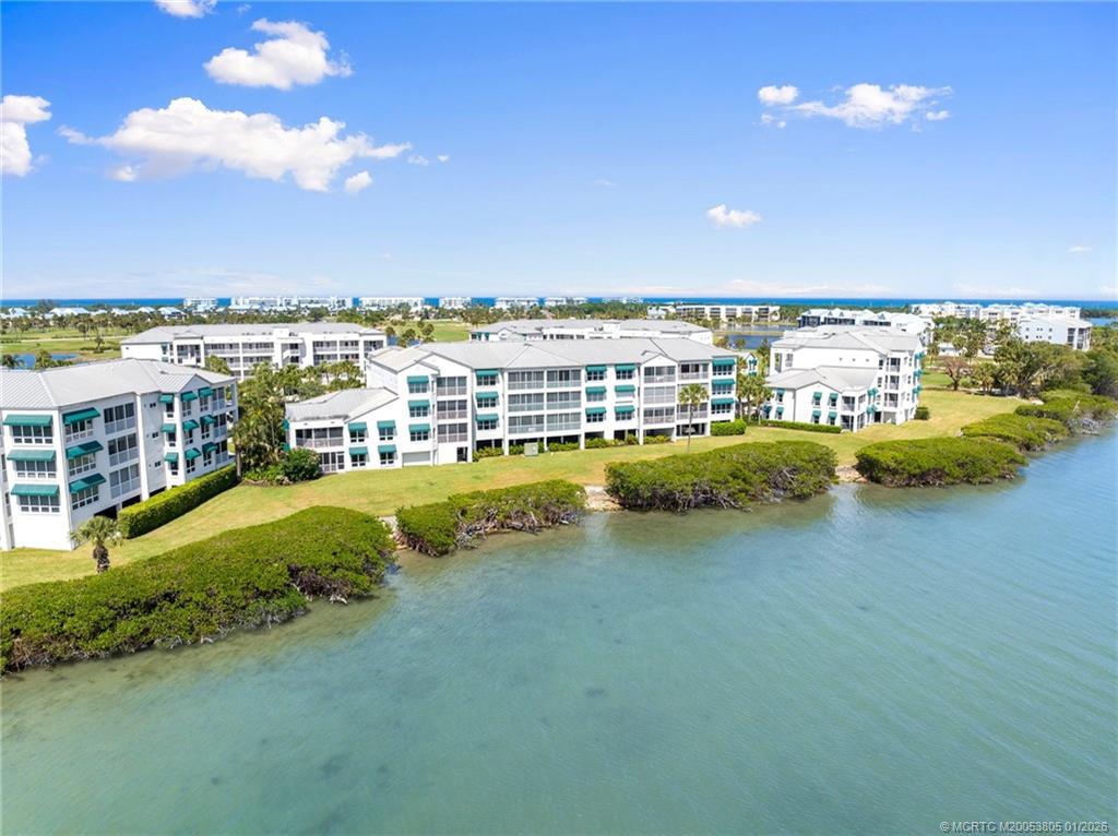 164 Northeast Edgewater Drive, Unit 2105 Jensen Beach, FL 34957 - Photo 34 of 35 a view of a city with tall buildings