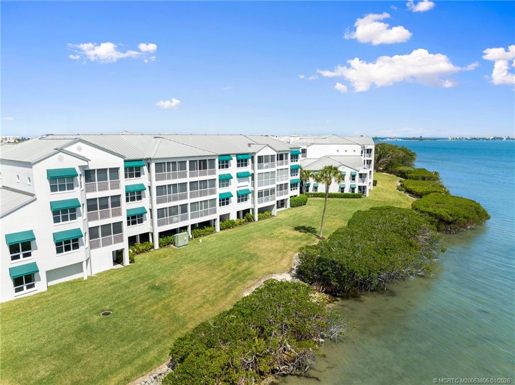 164 Northeast Edgewater Drive, Unit 2105 Jensen Beach, FL 34957 - Photo 4 of 35 a view of a city with tall buildings