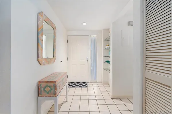 a view of an entryway with wooden floor