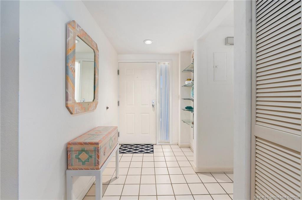 164 Northeast Edgewater Drive, Unit 2105 Jensen Beach, FL 34957 - Photo 5 of 35 a view of an entryway with wooden floor