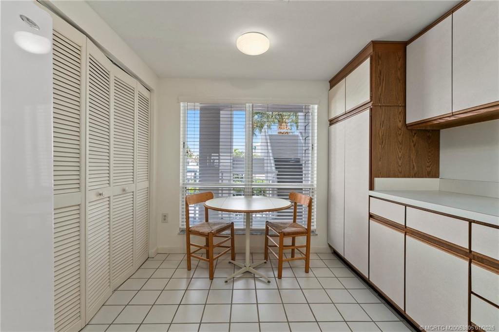 164 Northeast Edgewater Drive, Unit 2105 Jensen Beach, FL 34957 - Photo 10 of 35 a dining room with furniture and window