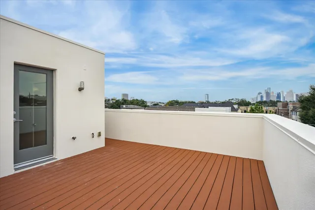 a view of a balcony with wooden floor