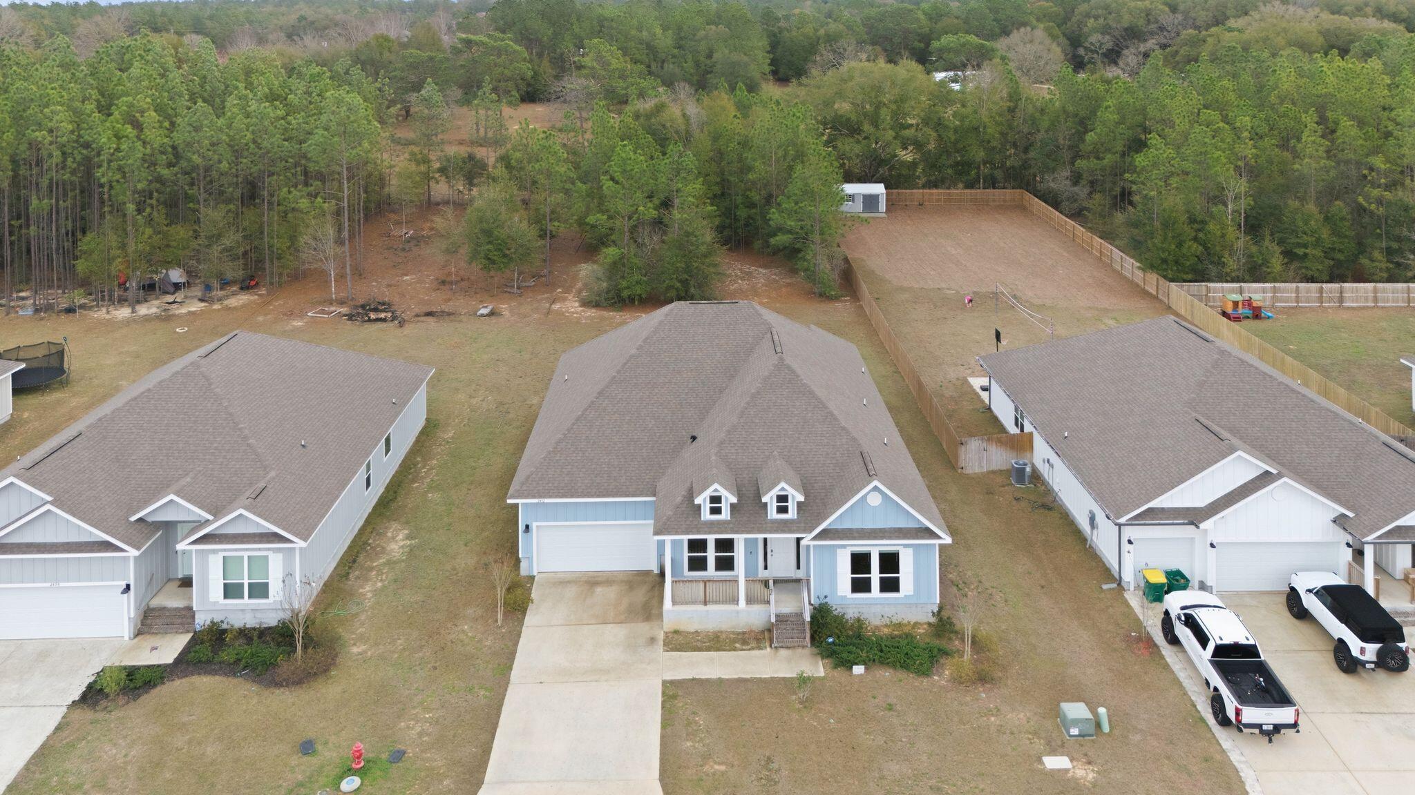 2452 Dakota Way Crestview, FL 32536 - Photo 5 of 29 an aerial view of a house with a garden