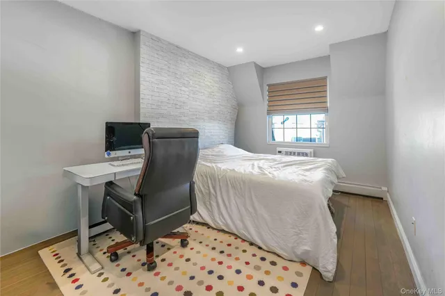 a bedroom with a bed and a table in it