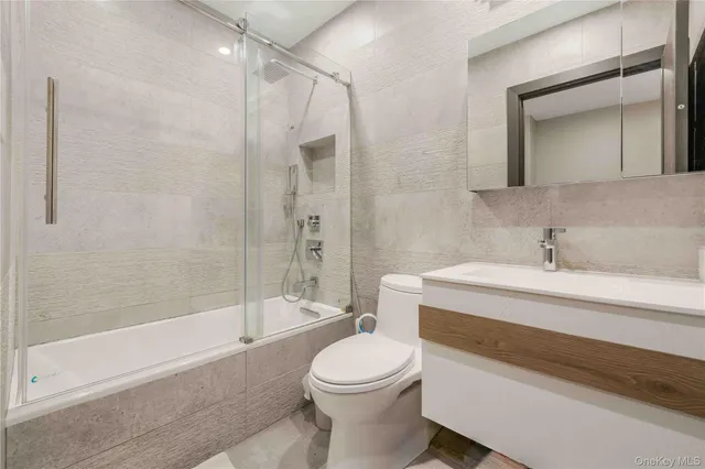 a view of kitchen with stainless steel appliances granite countertop sink and cabinets