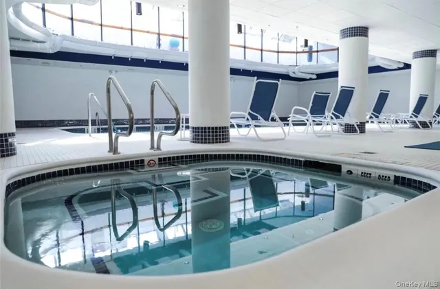 a view of swimming pool with a patio