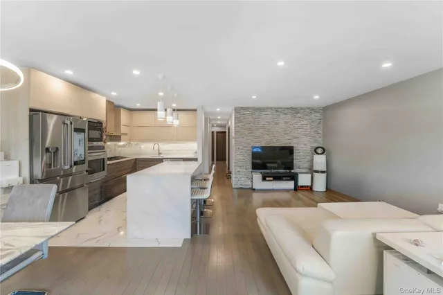 a large kitchen with a large counter top appliances and cabinets