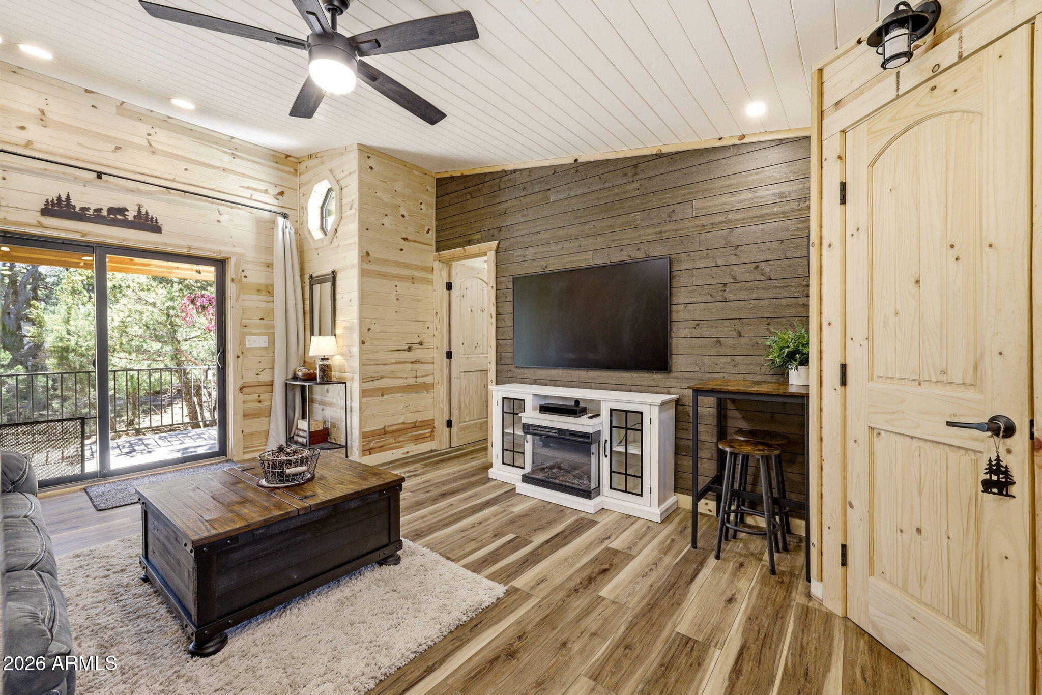 2787 Deer Hill Overgaard, AZ 85933 - Photo 8 of 44 a living room with furniture and a flat screen tv
