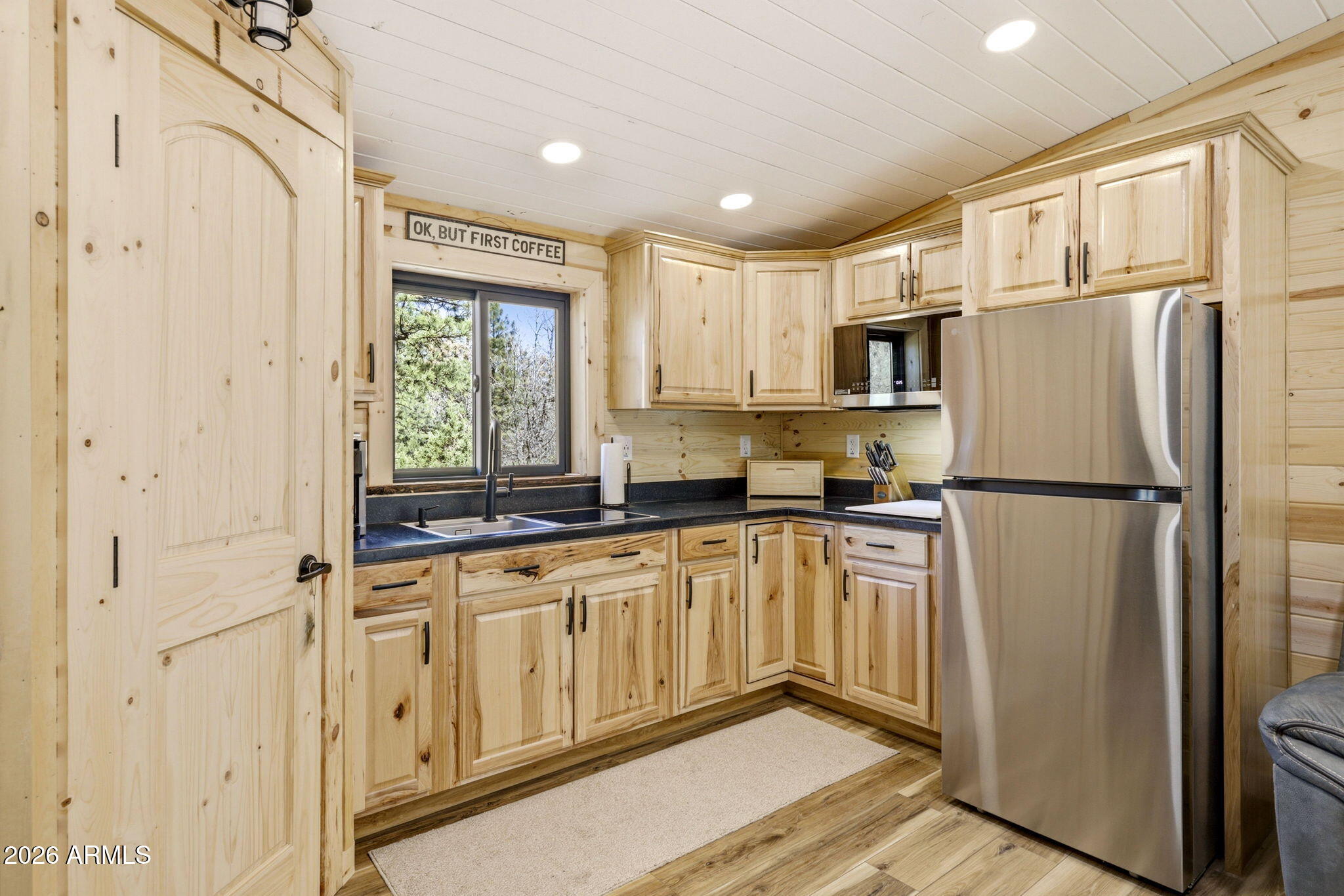 2787 Deer Hill Overgaard, AZ 85933 - Photo 9 of 44 a kitchen with stainless steel appliances a refrigerator sink and cabinets