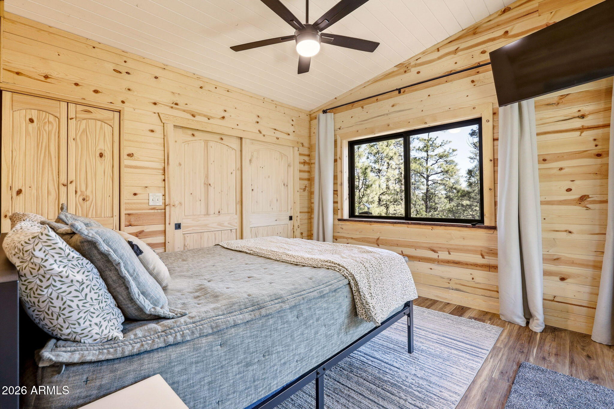 2787 Deer Hill Overgaard, AZ 85933 - Photo 11 of 44 a bedroom with a bed and a window