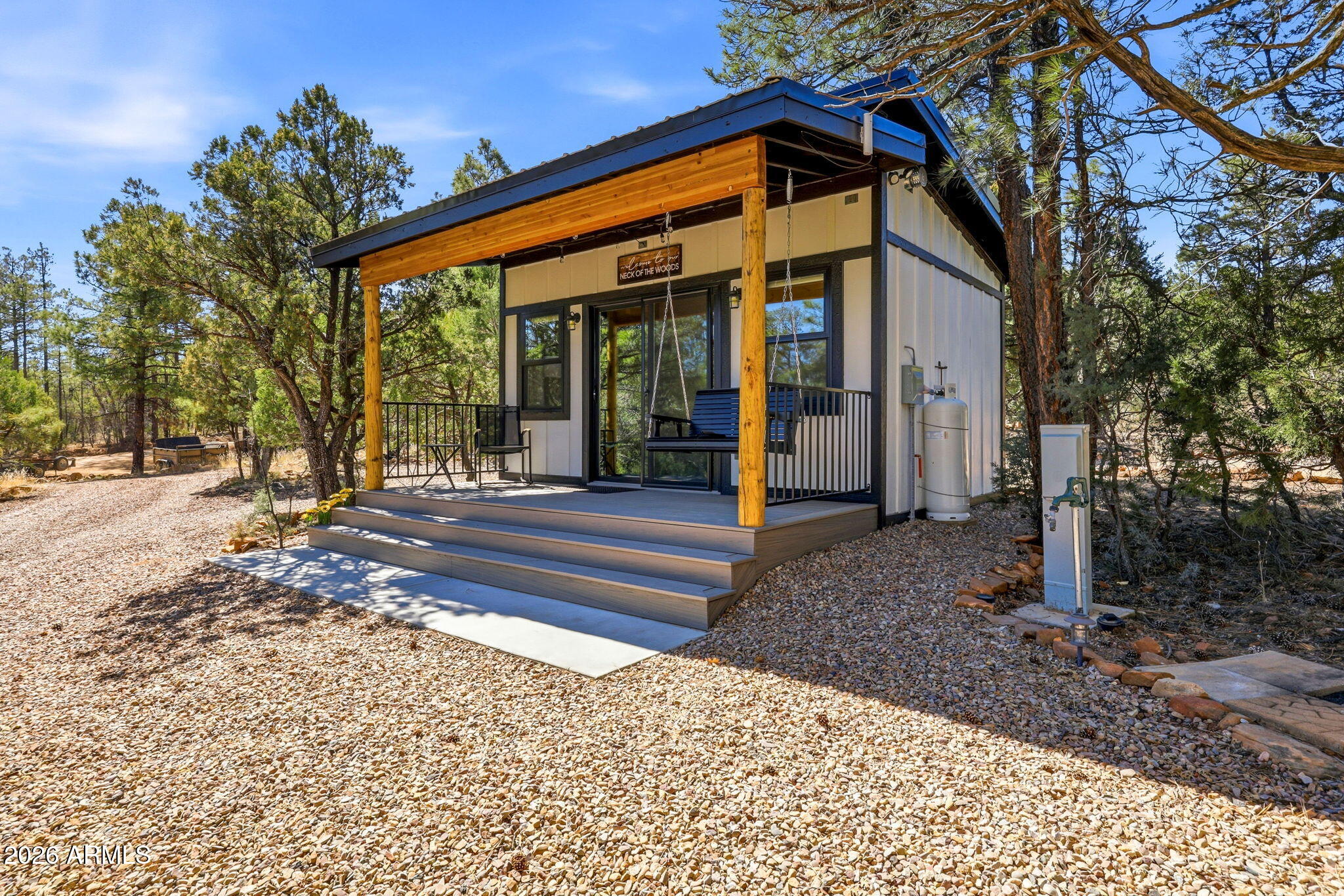 2787 Deer Hill Overgaard, AZ 85933 - Photo 18 of 44 a front view of a house with a porch