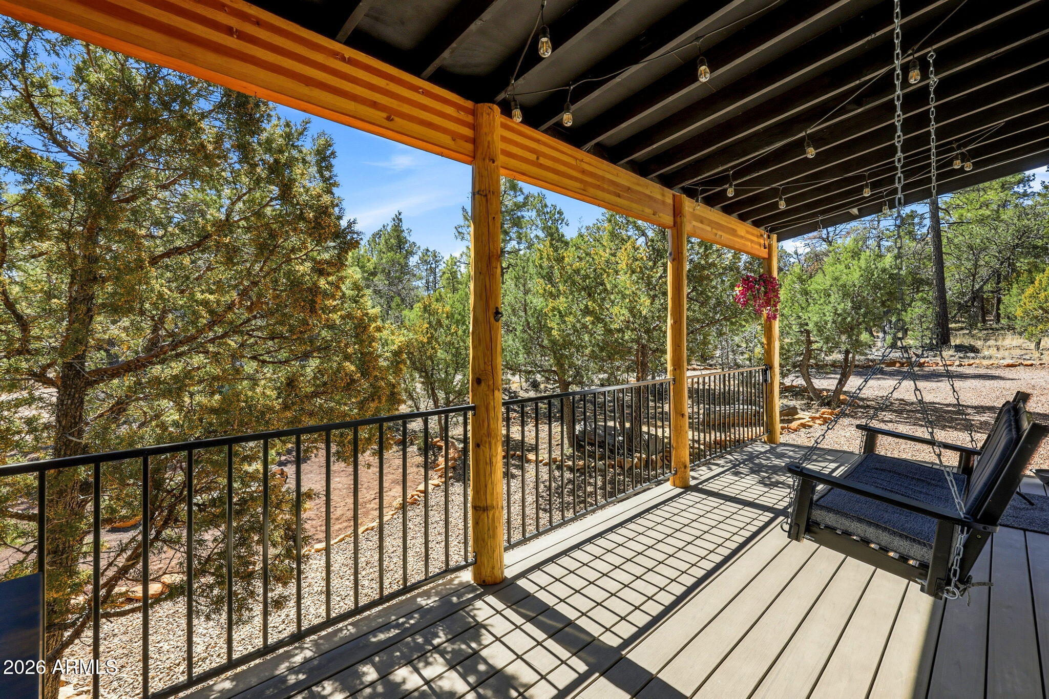 2787 Deer Hill Overgaard, AZ 85933 - Photo 4 of 44 a view of a balcony with wooden floor