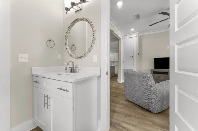 a en suite bathroom with a sink and a mirror