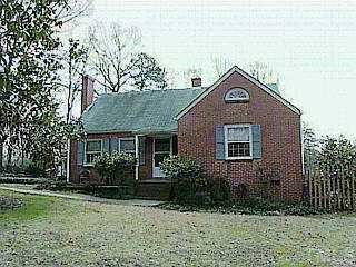 4217 Reavis Road Raleigh, NC 27606 - Photo 1 of 1 a front view of a house with garden